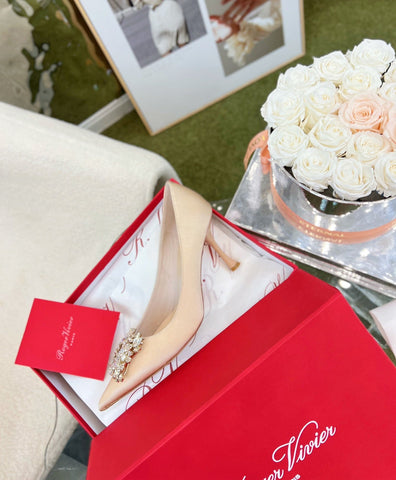 EFFLORESCENCE POINTED-TOE PUMPS IN NUDE SATIN WITH CRYSTAL BUCKLE
