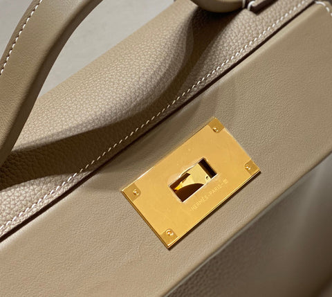 HM 26S 24/24 29MM IN BROWN EVERCOLOR CALFSKIN GOLD KELLY BUCKLE