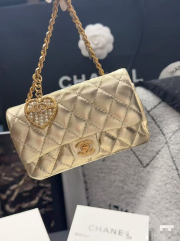 CC CLASSIC FLAP BAG 13 IN GOLD LAMBSKIN WITH PEARL HEART CHARM