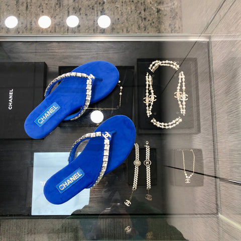 THONG SLIDE IN COBALT BLUE SUEDE WITH WHITE CRYSTALS