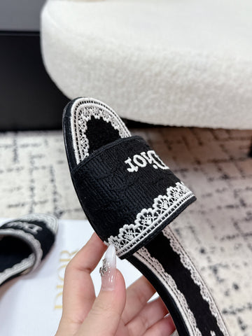 DIOR 26S HIGH HEEL SLIDES IN BLACK AND WHITE EMBOSSED OBLIQUE LACE EMBROIDERY