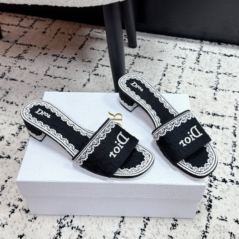 DIOR 26S HIGH HEEL SLIDES IN BLACK AND WHITE EMBOSSED OBLIQUE LACE EMBROIDERY