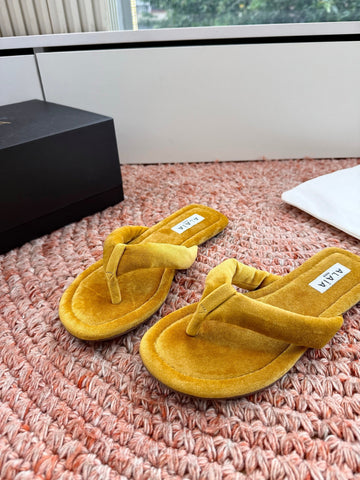 ALAIA 26S THONG SANDALS IN MUSTARD YELLOW VELVET