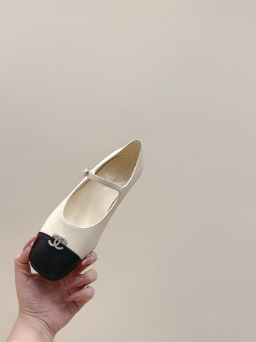 CHANEL 25S MARY JANE FLATS IN IVORY LAMBSKIN WITH BLACK CAP TOE SILVER HARDWARE