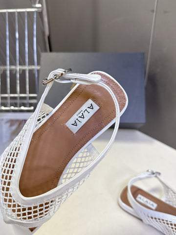 ALAIA 26S FLAT MESH THONG SANDALS IN WHITE PATENT CALFSKIN