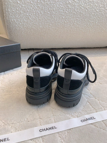 CHANEL 25S TRAINERS 40MM IN BLACK AND WHITE CALFSKIN AND SUEDE