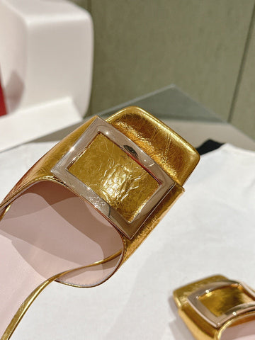 TRUMPET METALLIC MULES IN GOLD PATENT CALFSKIN