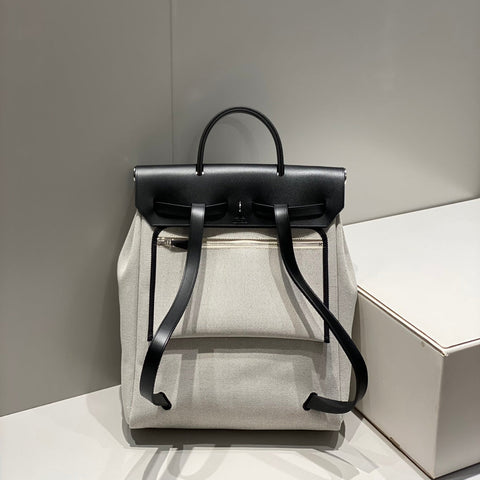 HERBAG A DOS ZIP RETOURNE BACKPACK 29 IN OFF-WHITE CANVAS AND BLACK CALFSKIN