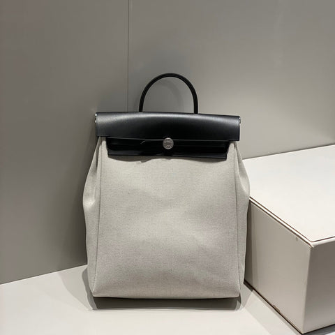 HERBAG A DOS ZIP RETOURNE BACKPACK 29 IN OFF-WHITE CANVAS AND BLACK CALFSKIN