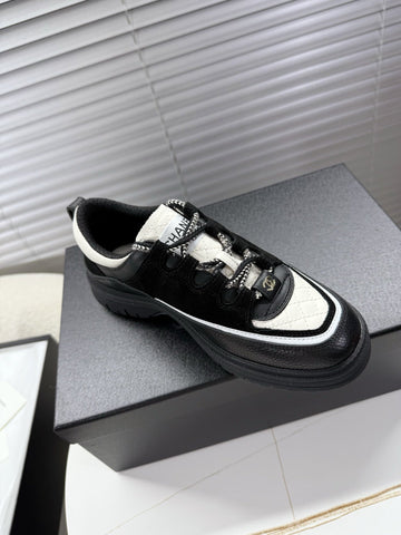 CHANEL 25S SNEAKERS 35MM IN BLACK AND WHITE CALFSKIN