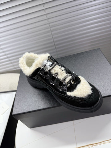 CHANEL 25S SNEAKERS WITH FUR ACCENTS 35MM IN BLACK CALFSKIN