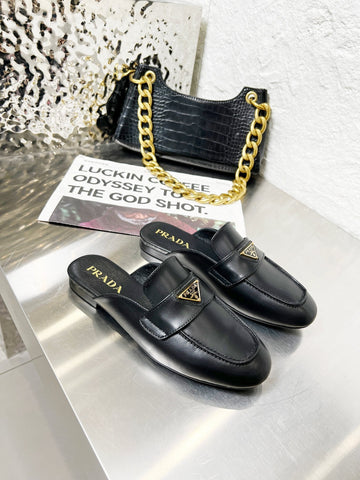 PRADA 26S MULE LOAFERS IN BLACK CALFSKIN WITH LOGO