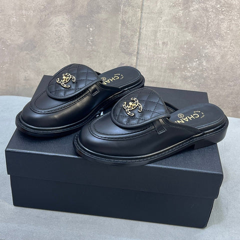 CHANEL 26S MULE LOAFERS IN BLACK QUILTED CALFSKIN WITH CC LOGO