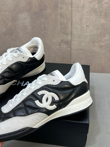 CHANEL 26S SNEAKERS IN BLACK AND WHITE QUILTED CALFSKIN CC LOGO