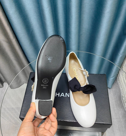 HIGH MARY JANE SHOES WHITE SHEEPSKIN WITH BLACK BOW