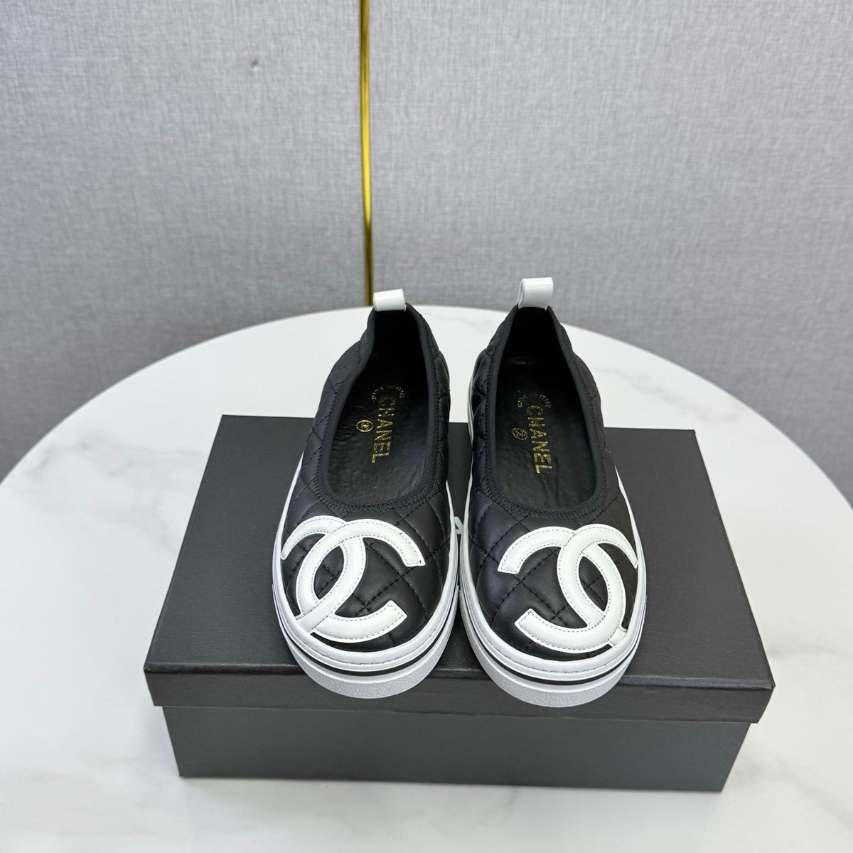 CHANEL 26S CC LOGO SLIP-ON SNEAKERS IN BLACK CALFSKIN