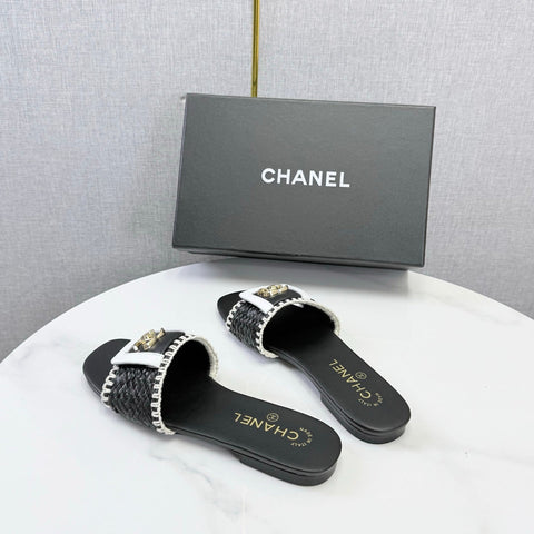 CHANEL 26S WOVEN STRAP SLIDES IN BLACK LAMBSKIN