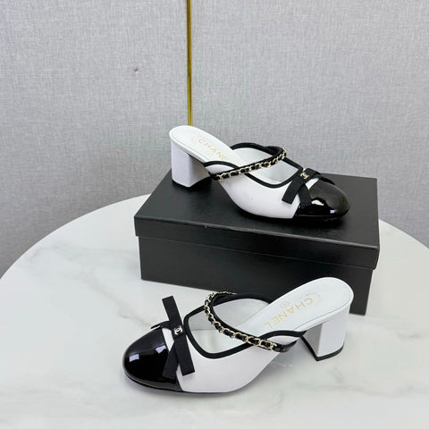 CHANEL 26S HIGH HEEL MULES 45 MM IN WHITE AND BLACK LAMBSKIN