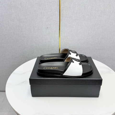 CHANEL 26S ICONIC CC SLIDES IN WHITE LAMBSKIN