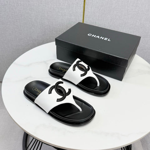 CHANEL 26S CC THONG SLIDES IN WHITE AND BLACK LAMBSKIN
