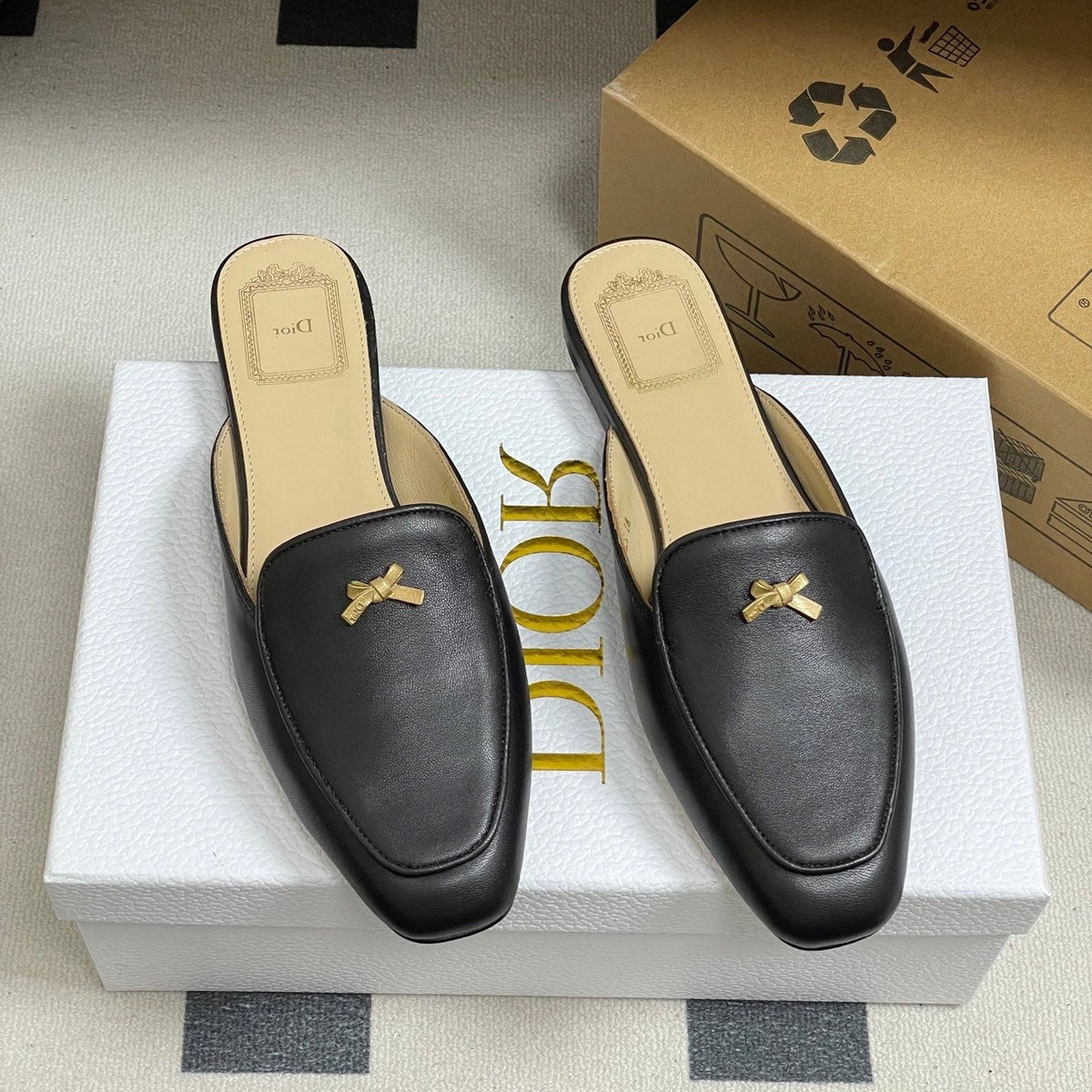 DIOR 26S MULES IN BLACK CALFSKIN WITH BOW