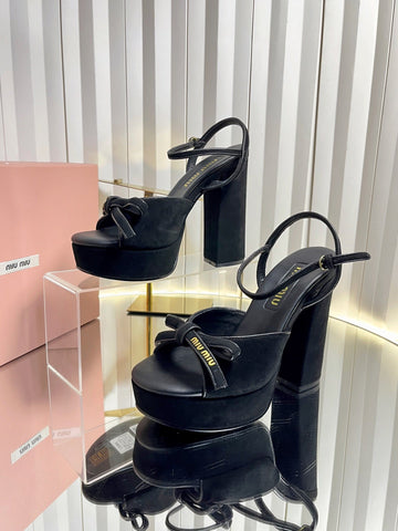 MIUMIU 26S PLATFORM ANKLE STRAP SANDALS 120MM IN BLACK SUEDE WITH BOW