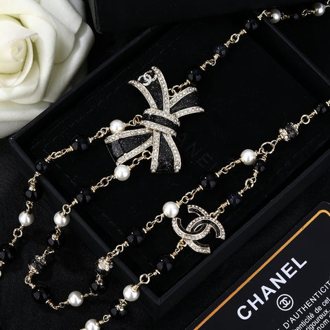 CHANEL 25S CHAIN BELT IN BLACK AND WHITE PEARL 614285