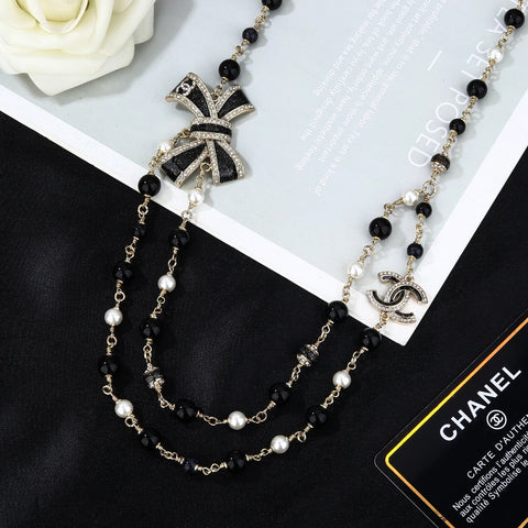 CHANEL 25S CHAIN BELT IN BLACK AND WHITE PEARL 614285