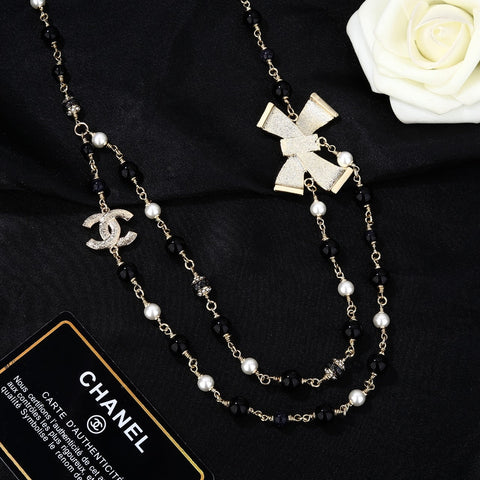 CHANEL 25S CHAIN BELT IN BLACK AND WHITE PEARL 614285