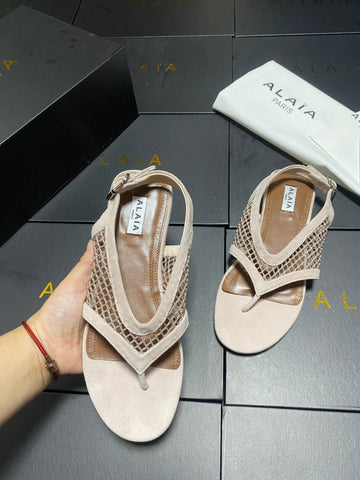 ALAIA 26S FLAT MESH THONG SANDALS IN BEIGE SUEDE