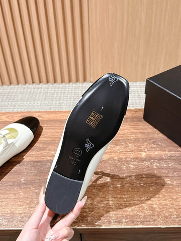 CHANEL 25S BALLET MARY JANES BLACK AND IVORY IN CALFSKIN