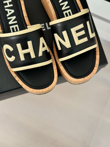 THICK SOLE LETTER SLIPPERS IN BLACK SHEEPSKIN