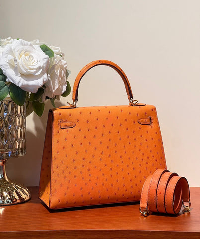 KELLY SELLIER 25 BAG IN FIRE ORANGE OSTRICH LEATHER WITH GOLD HARDWARE
