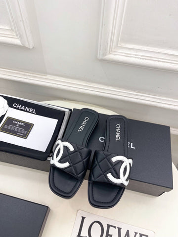 CHANEL 26S FLAT SLIDES IN BLACK LAMBSKIN WITH WHITE CC LOGO