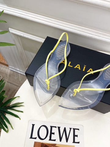 ALAIA 26S POINTED-TOE THONG SANDALS IN YELLOW AND TRANSPARENT PVC