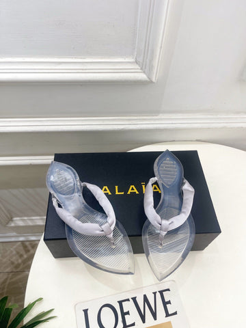 ALAIA 26S THONG SANDALS IN PEARL GREY SATIN AND TRANSPARENT PVC